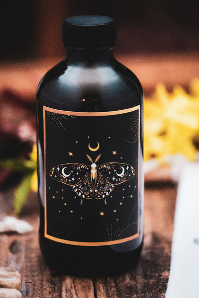 Moth Moon Water Glass Bottle