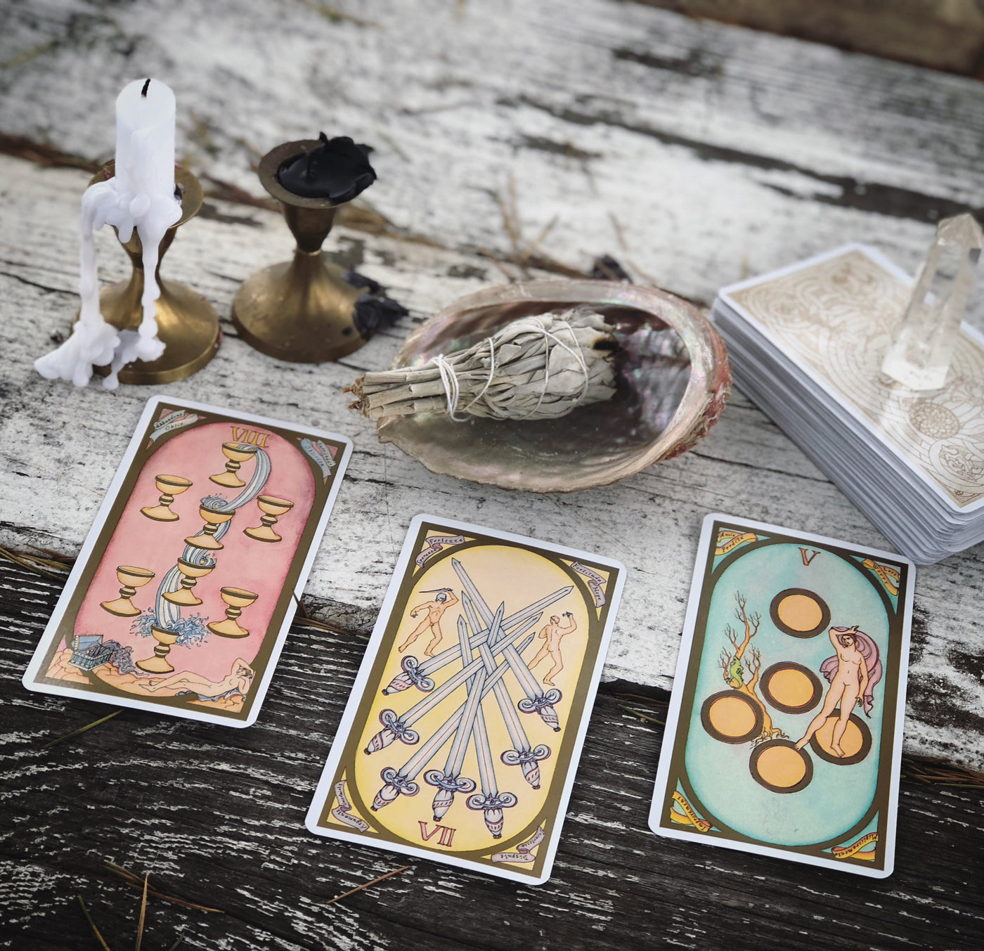 Three assorted The Renaissance Tarot deck cards on display.