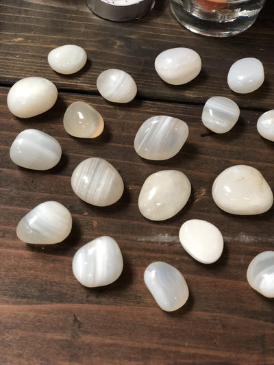Banded White Onyx spread on a table. 
