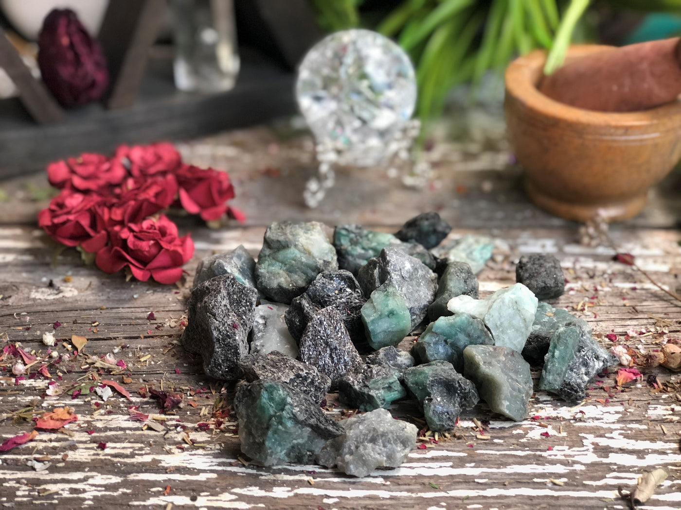 A handful of rough Emerald pieces laid out
